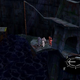 Three figures in what look like mech suits stand on a rocky platform jutting out over a chasm.